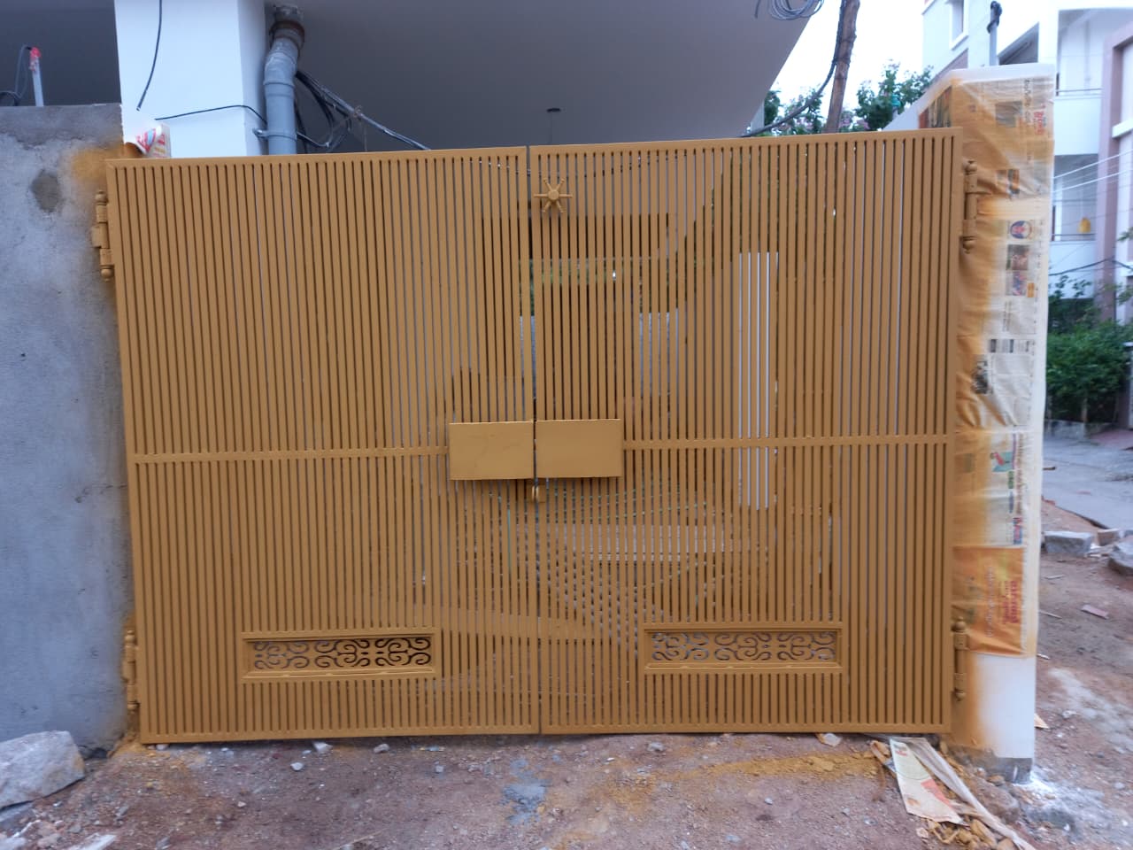 Decorative gate with laser-cut ornamental pattern