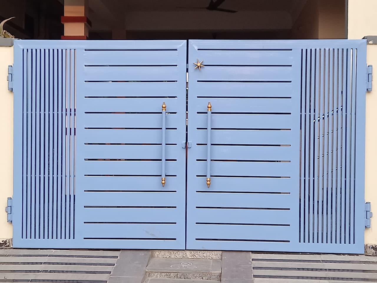 Modern horizontal slat gate with brass handles