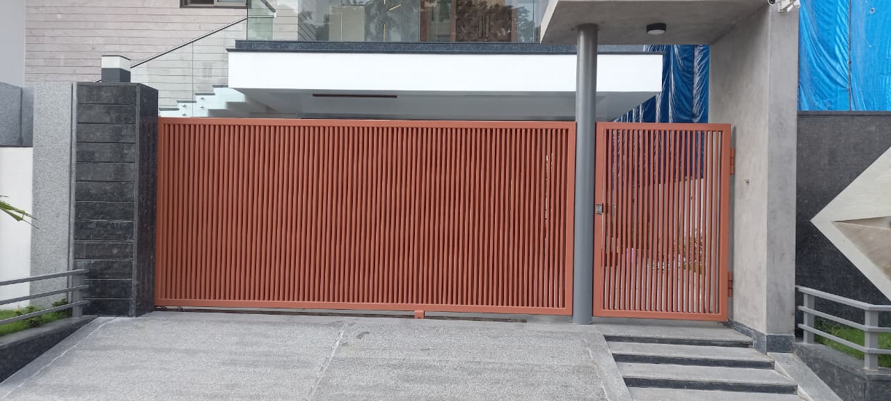 Large sliding gate with matching pedestrian wicket gate
